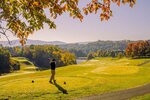 Landscape view of a bright and sunny golf course and golfer