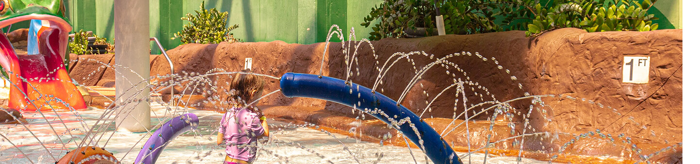 Children splashing in the kids zone at Massanutten indoor water park